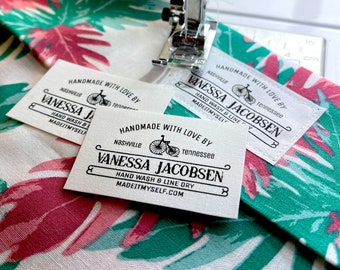 Flat custom fabric labels in a simple vintage style. Personalize with your name or business name. 2"W x 1.25"H, 30 per sheet. 100%  cotton