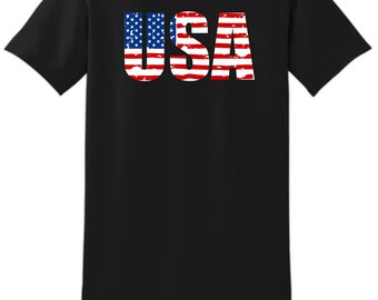 May include: Black t-shirt with a distressed American flag design spelling out "USA".