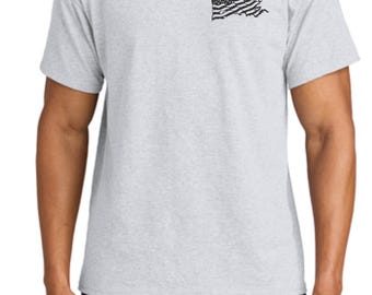 May include: A heather grey t-shirt with a distressed American flag design on the left chest.