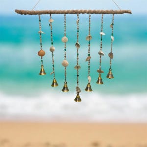 May include: A white ceramic mug with a black handle and the text "But First, Coffee" in a bold, black font. The mug is set against a blurred background, suggesting a cozy setting.
