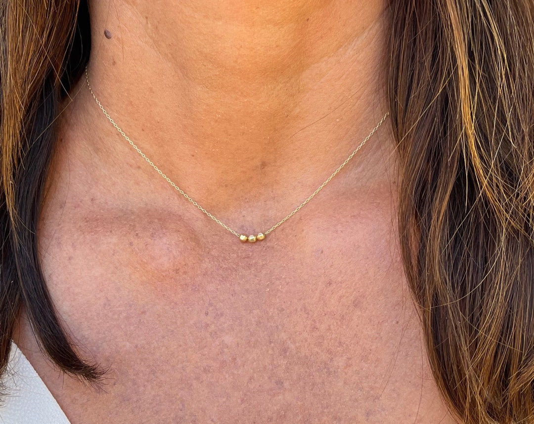 Tiny gold on sale bead necklace