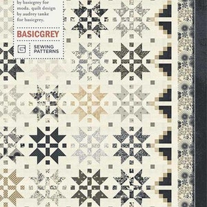 May include: A quilt pattern called "Let's Dance" by BasicGrey, featuring a date night design with a black, white, and gray color scheme. The pattern is for a quilt with a star design.