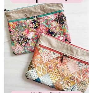 May include: Two rectangular fabric pouches with double zippers and patchwork designs. One features floral patterns with a teal zipper, the other has geometric prints with a coral zipper. Text reads: Divided Double Zip pouch, Mini Charm Friendly Finished Size 9" x 12", Sew Lux fabric by Chrissy Lux of Sew Lux Fabric.