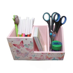 Pencil box butterflies made of wood as an organizational aid for the desk