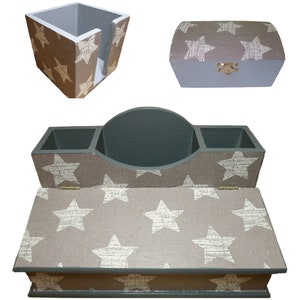 May include: A set of three grey and brown wooden boxes with a star pattern. The boxes are designed to hold various items, such as pens, pencils, and other office supplies.