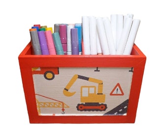 Wooden pen box with construction site excavator