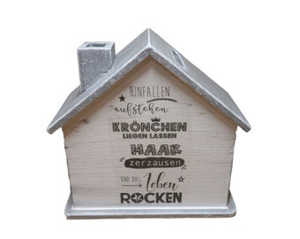 Money box house with saying with name