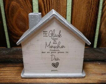 Money box house with saying with name