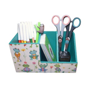 Wooden frog pencil box as an organizational aid for the desk