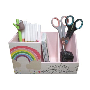 Rainbow pencil box made of wood as an organizational aid for the desk