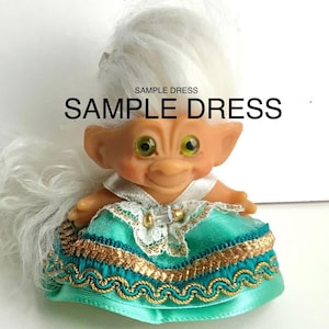 May include: A set of three ceramic mugs with a speckled, matte finish. The mugs are in shades of cream, light gray, and dark gray. Each mug has a simple, minimalist design, perfect for coffee or tea.