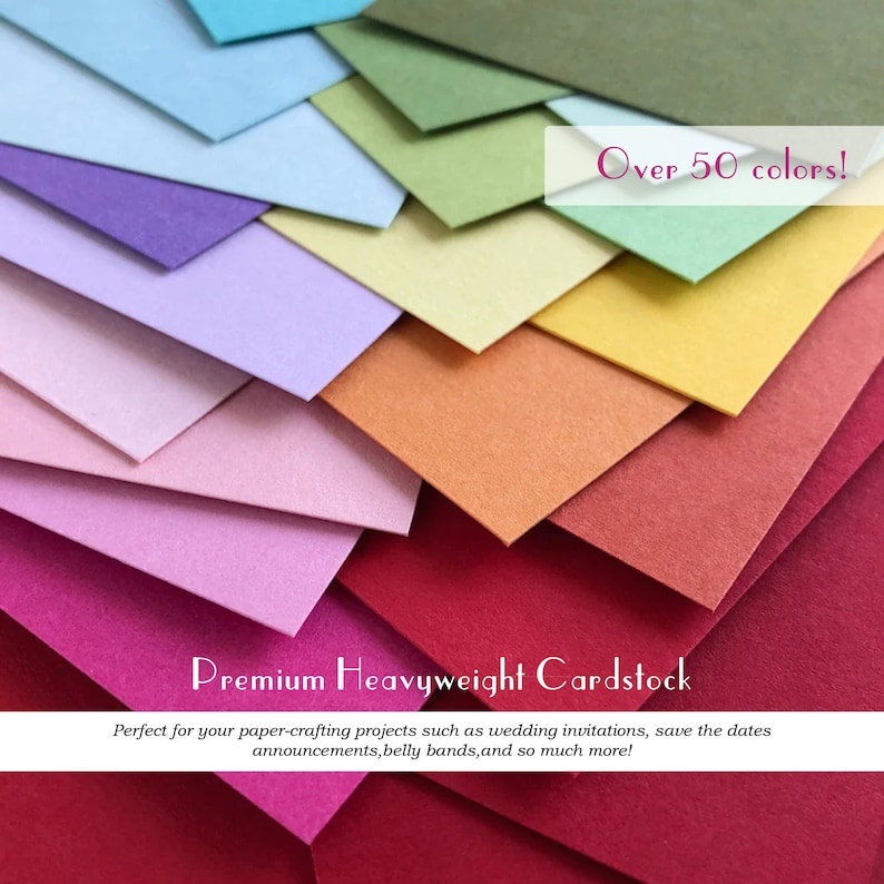 May include: A stack of colorful cardstock paper in various shades of blue, green, purple, pink, orange, red, and yellow. The text "Over 50 colors!" is displayed in white letters on a pink background. The text "Premium Heavyweight Cardstock" is displayed in white letters on a black background. The text "Perfect for your paper-crafting projects such as wedding invitations, save the dates announcements, belly bands, and so much more!" is displayed in white letters on a black background.