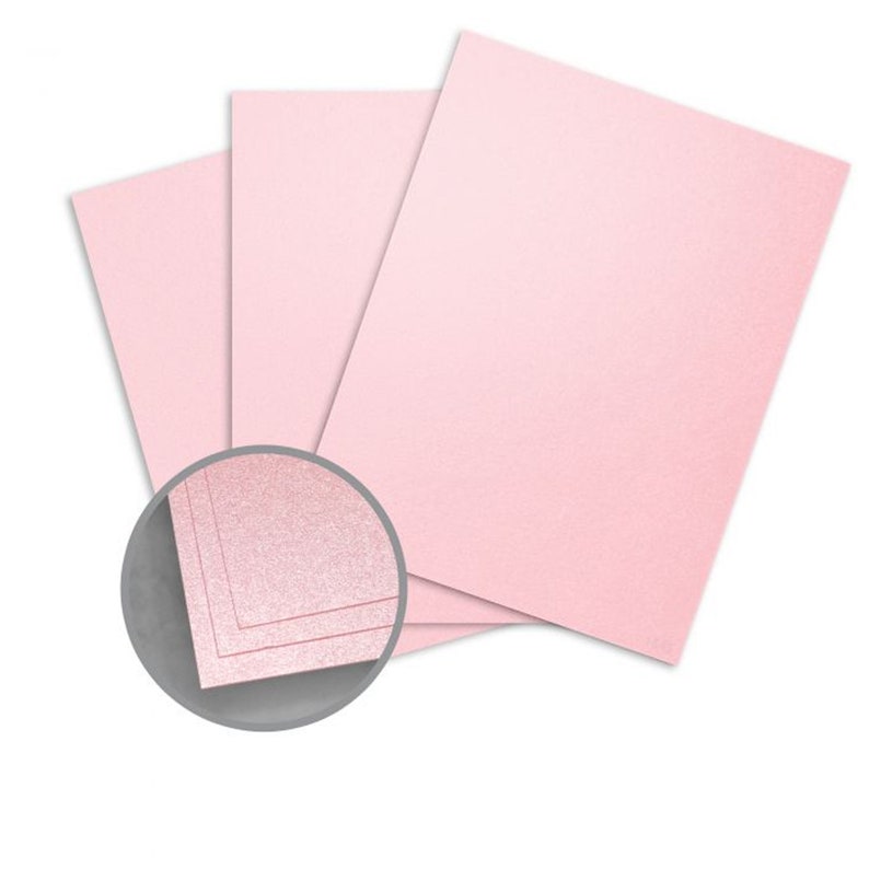 May include: Three sheets of light pink cardstock with a subtle shimmer finish. The cardstock is shown folded in thirds, with a close-up of the edge showing the shimmer.