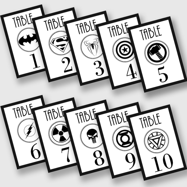 May include: Ten black and white table number cards with superhero logos. The numbers are 1 through 10. The logos include Batman, Superman, Spiderman, Captain America, Thor, The Flash, The Radioactive Symbol, The Punisher, Green Lantern, and Iron Man.