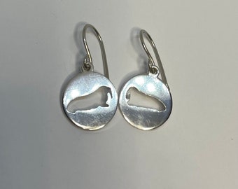 Walrus cut out round earrings