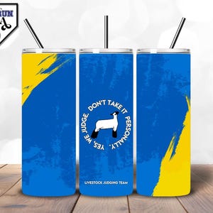 May include: Three stainless steel tumblers with a blue and yellow design. The tumblers have a white circle with the text "Yes We Judge Don't Take It Personally" and a black and white illustration of a sheep. The text "Livestock Judging Team" is printed below the circle.