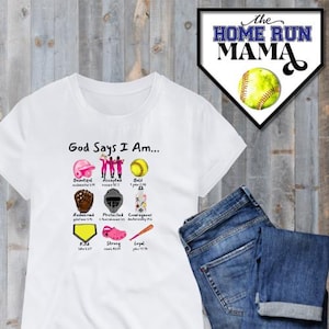 May include: White t-shirt with the text "God Says I Am..." and a graphic of softball equipment with bible verses. The graphic includes a softball, glove, helmet, cleats, and a bat.