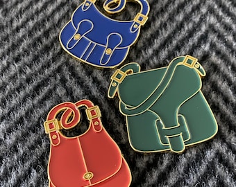 Enamel pin featuring Vintage Coach Rust Crescent, Pine Green Courier & Navy Blue Pony Express bags