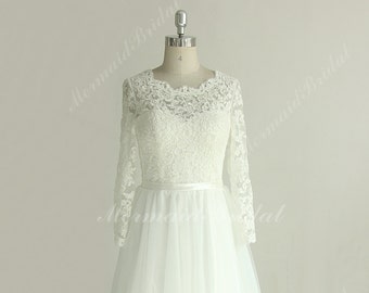 Romantic flowy tulle lace destination wedding dress with keyhole back and long sleeves