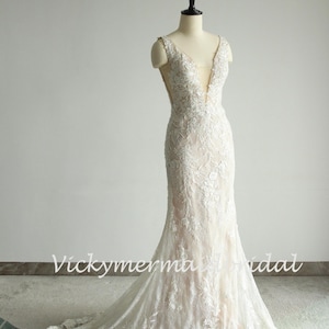 Elegant Lace Mermaid Wedding Gown: Fit and Flare, Deep V Neck