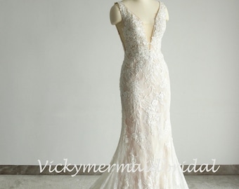 Elegant Lace Mermaid Wedding Gown: Fit and Flare, Deep V Neck