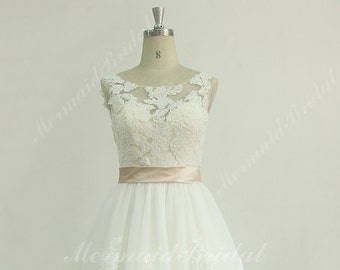 Romantic ivory a line lace wedding dress with blush lining and illusion neckline