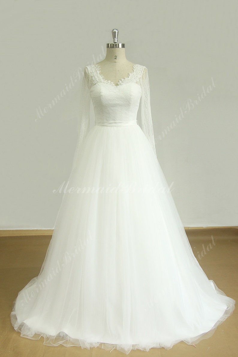 Open back long sleeved tulle lace wedding dress with deep v neckline 