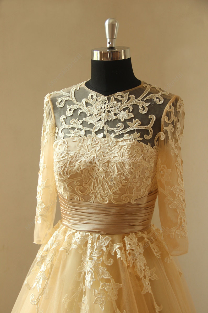 Vintage chanpamgne tea length lace wedding dress with mid sleeves