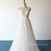 Fairy flowy a-line tulle lace wedding dress,beach wedding gown with pale blush lining and deep V neckline 