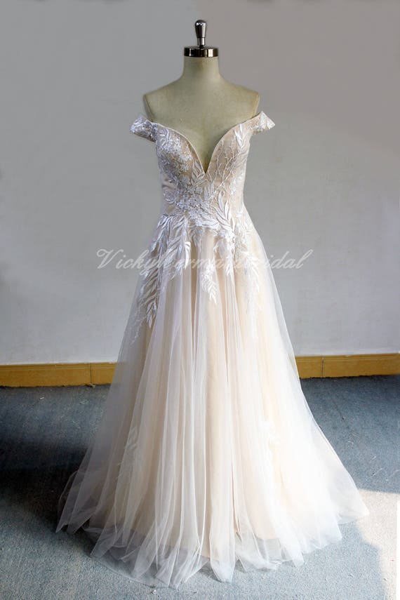 off the shoulder flowy wedding dress