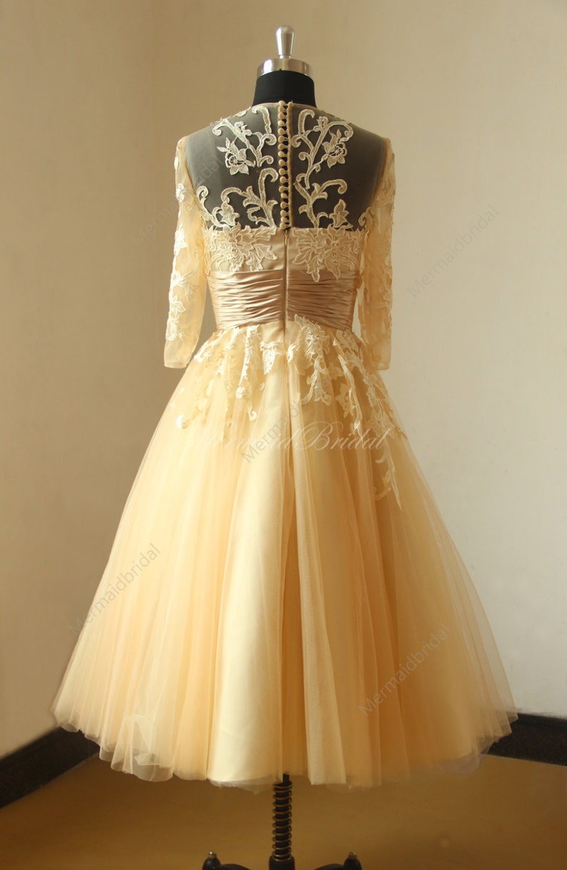 Vintage chanpamgne tea length lace wedding dress with mid sleeves