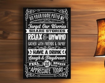 May include: Black and white sign with a decorative border and the text "On your name patio we forget our worries, share stories, relax & unwind, gather with friends & family, have a drink, laugh & daydream, feel the breeze, appreciate today."
