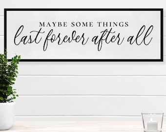May include: A black framed sign with white background and the text "Maybe some things last forever after all" in black cursive font.