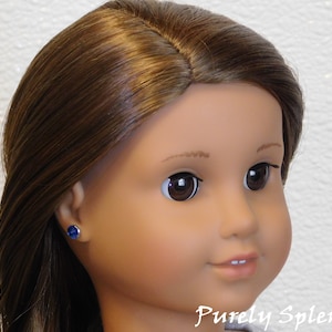 18 inch doll shown wearing a pair of Capri Blue 2mm Studs