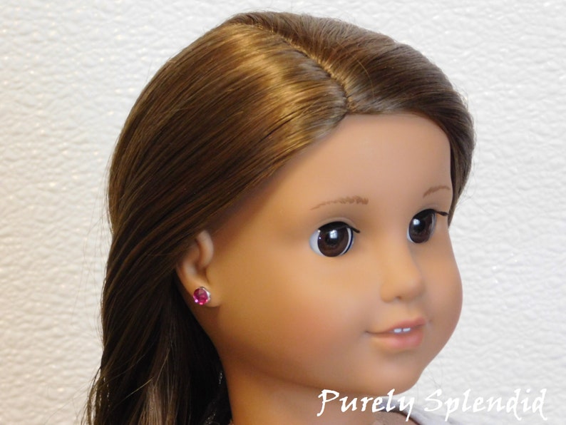 18 inch doll shown wearing a pair of Fuchsia 2mm Studs