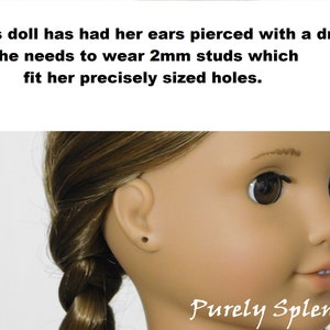18 inch doll shown with pierced ears. This doll has had her ears pierced with a drill. She needs to wear 2mmstuds which fit her precisely sized holes.