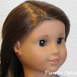 18 inch doll shown wearing a pair of Light Siam 2mm Studs