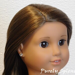 18 inch doll shown wearing a pair of Crystal 2mm studs