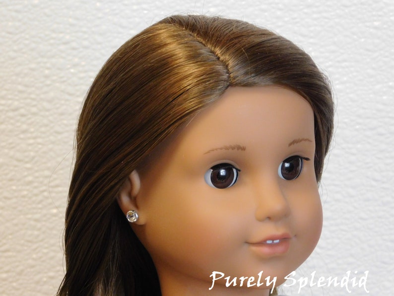 18 inch doll shown wearing a pair of Crystal 2mm studs