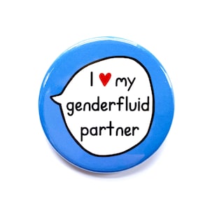 May include: A blue button with a white speech bubble that says "I love my genderfluid partner" with a red heart.