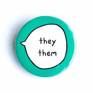May include: A teal blue button with a white speech bubble that says "they them" in black text.