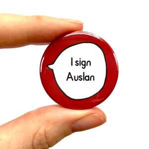 May include: Red button with a white speech bubble that says "I sign Auslan".