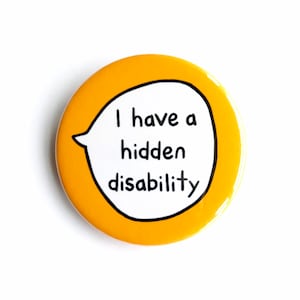 May include: A yellow button with a white speech bubble that says "I have a hidden disability".