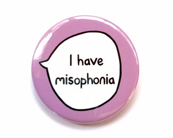 May include: A purple button with a white speech bubble that says "I have misophonia".