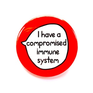 May include: Red round button with white text that reads "I have a compromised immune system" in a speech bubble.