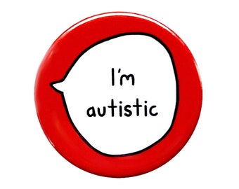 May include: A round, red button with a white speech bubble containing the words "I'm autistic" in black text. The button is a pinback style, suitable for attaching to clothing or bags.