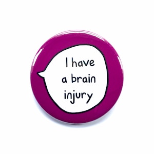 May include: A purple button with a white speech bubble that says "I have a brain injury".