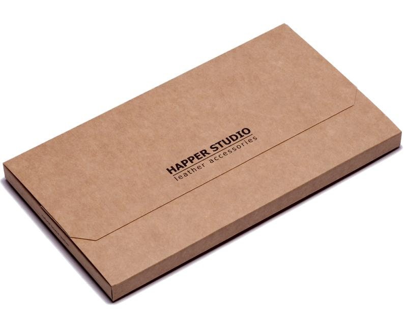 May include: A brown cardboard box with the text "Happer Studio leather accessories" printed on the front.