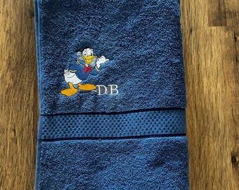 Juego de toallas de regalo para fans del Pato Donald: cara, manos, baño y sábanas.