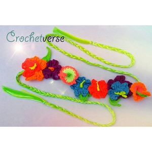 May include: A crocheted flower garland with bright colors, including orange, red, purple, blue, and green. The garland is made of yarn and has a long, braided cord.